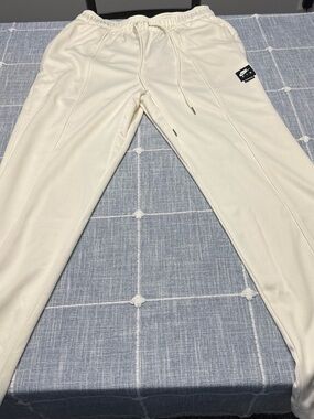 Nike Cream Drawstring Joggers with Black Logo Patch